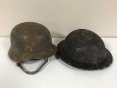 A German Third Reich M35 helmet and a Brodie helmet (2)