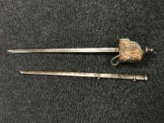 A Victorian Scottish basket-hilted sword in scabbard