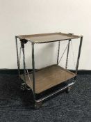 A late 20th century chrome and plastic West German folding tea trolley