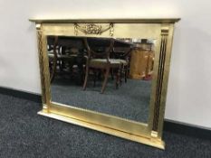 An ornate gilt framed overmantle mirror