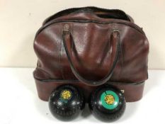 A bowls bag containing a large quantity of assorted lawn bowls