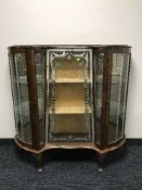A walnut 1930's shaped display cabinet