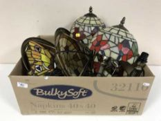 A box of three Tiffany style lamps with shades together with two light shades