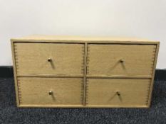 An oak four drawer chest