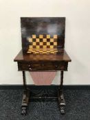 A Victorian rosewood work table with chessboard interior