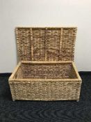 A large wicker laundry hamper