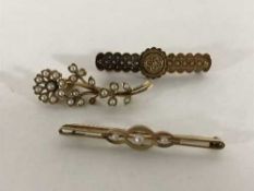 Three 15ct gold brooches, two set with pearls, 8.