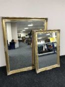 Two decorative gilt framed bevelled overmantel mirrors