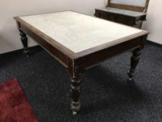 A Victorian mahogany kitchen table