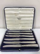 A set of six silver handled butter knives by Mappin & Webb,
