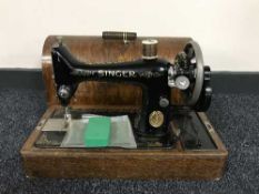 Two cased Singer sewing machines