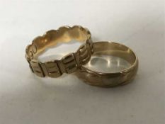 A 9ct gold Celtic band ring, and another 9ct band ring (5.