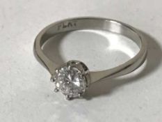 A platinum diamond solitaire ring