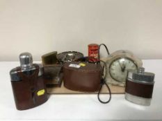 A tray containing two hip flasks, travel clock, cigarette dispenser, mantel clock,