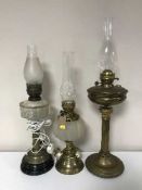 Three brass oil lamps,