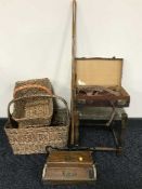 An early 20th century oak stool, small leather briefcase, wicker baskets,