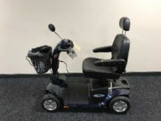 A Electro Motion Super Glide disability cart with keys, charger,