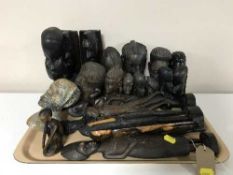 Two trays of carved African figures, miner figure,