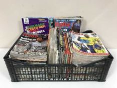 Two boxes of football annuals and magazines