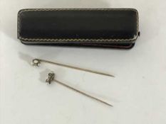 Two antique gold pins set with diamonds and pearls