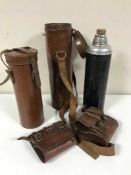 A basket of two cylindrical flask cases,