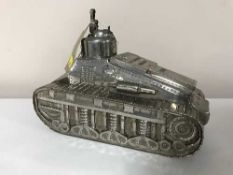 A silver plated table lighter/cigarette case modelled as a WWII tank