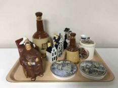 A tray of four KLM Bols decanters in the form of houses, two prattware pot lids,