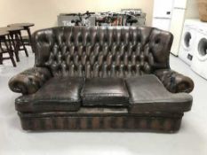 A Chesterfield style button back three seater settee