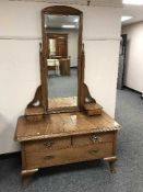 A continental oak mirrored dressing table