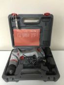 A Performance cordless 12 volt drill with battery and charger