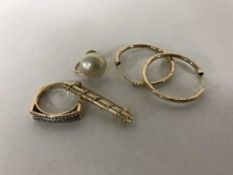 A pair of 9ct gold hoop earrings, 9ct gold dress ring,