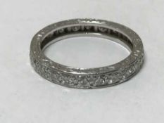 A platinum diamond eternity ring, size L.
