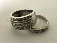 Two white gold rings set with diamonds,