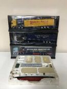 Three Corgi modern truck vehicles together with a Minic miniature boat and platforms