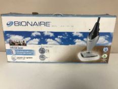 A boxed steam mop, shredder,