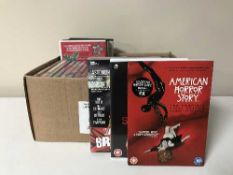 Two boxes of CDs and DVDs