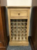 A reclaimed pine bottle rack fitted a drawer