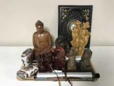 A tray containing carved oriental figures including seated Buddha,
