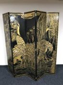 A oriental five fold lacquered and gilt screen