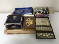 A tray containing boxed set of six plated teaspoons, box of playing cards,