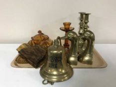 A tray of amber glass dressing table set, brass candlesticks,