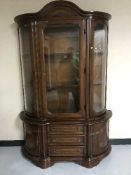 An Italian style bow-fronted display cabinet