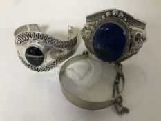 A silver bracelet set with lapis lazuli,