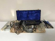 A tray of plated toast rack, coffee pot, chamber stick, salt,