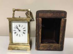 A brass striking and repeating carriage clock in travel case with key,