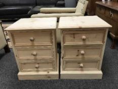 A pair of light pine three drawer chests