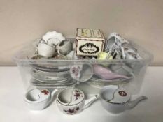 Two boxes containing a quantity of English porcelain, sewing box and contents,
