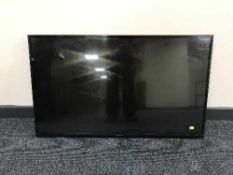 A Panasonic 42 inch TV with lead and remote