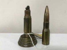 A brass trench art table lighter in the form of a bullet