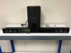 An LG 300 watt sound bar system with speaker and remote